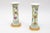 Small gu-form porcelain vases decorated with pink family enamels on a yellow background, adorned with green interlace....