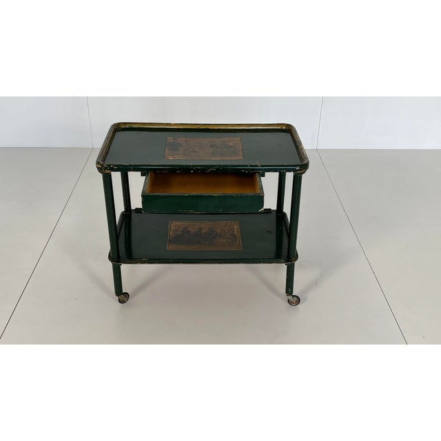 Wooden tea trolley from the 1930s. Classic design with turn-of-the-century decor and a drawer. The tea trolley is in...