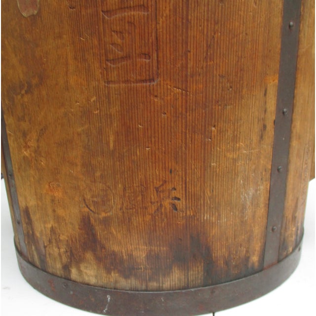 Antique Japanese Itomasu, carved from one piece of wood and reinforced by iron bands at the top and bottom. Handmade and...