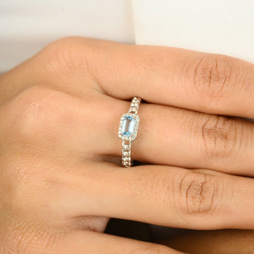 Baguette Blue Topaz with Halo Diamonds Engagement Ring in 14k White Gold featuring natural blue topaz of 0.33 carats and...