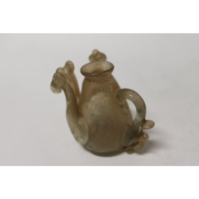 Antique Roman Glass Ewer with Handle and Twin Piped Spouts Striking antique Roman-style glass ewer featuring a graceful...