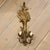 Pair of French carved giltwood wall sconces featuring elongated diamond-carved urn forms issuing dramatic carved foliate...