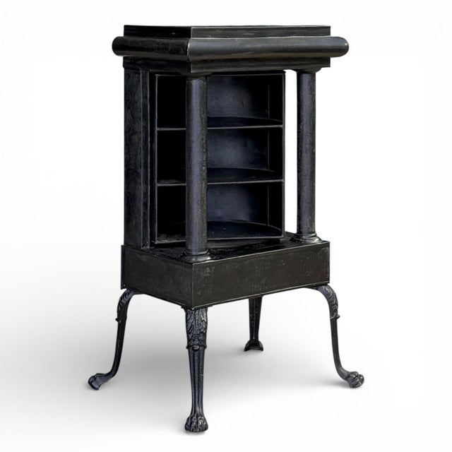 A highly unusual English Regency plate warmer in the neoclassical taste having “japanned” paint decoration in gilt over...