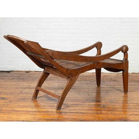 Brown Antique Indonesian Reclining Plantation Chair with Bamboo Slats and Carved Decor For Sale - Image 8 of 11