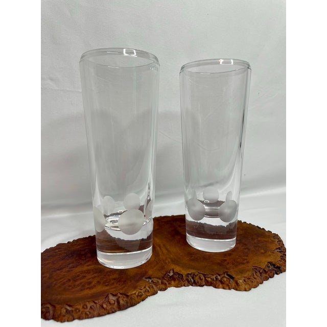 A pair of blown crystal vases designed by Vera Wang for Wedgewood. Tapered form with beveled edges and frosted dots around...