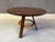 Elegant art deco center table or dining table with marquetry inlay top and a tripod base. The beautiful mix of colours and...