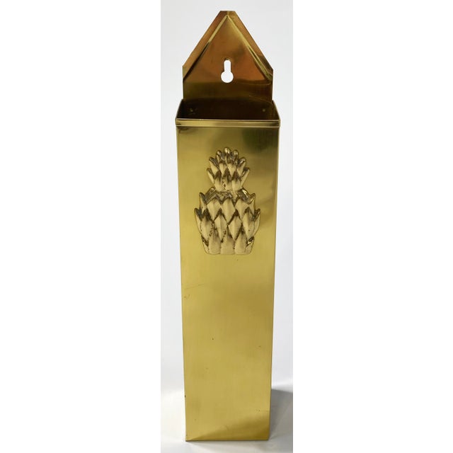 Function meets style with this vintage brass tall matchstick holder featuring large embossed pineapple figure on front....
