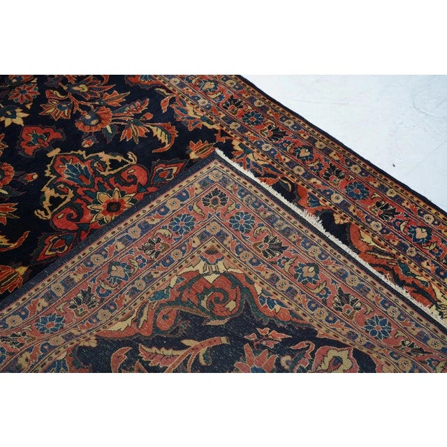 Well-woven, dark blue ground interwar Sarouks are often attributed to Mohajeran village, This scatter shows a navy field...