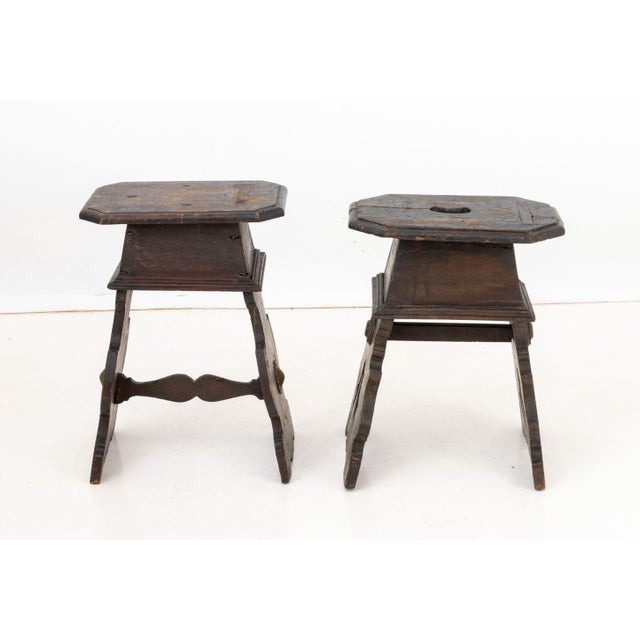 Assembled Pair of Renaissance Revival Carved Walnut Stools, each with rectangular canted corner tops above apron box with...