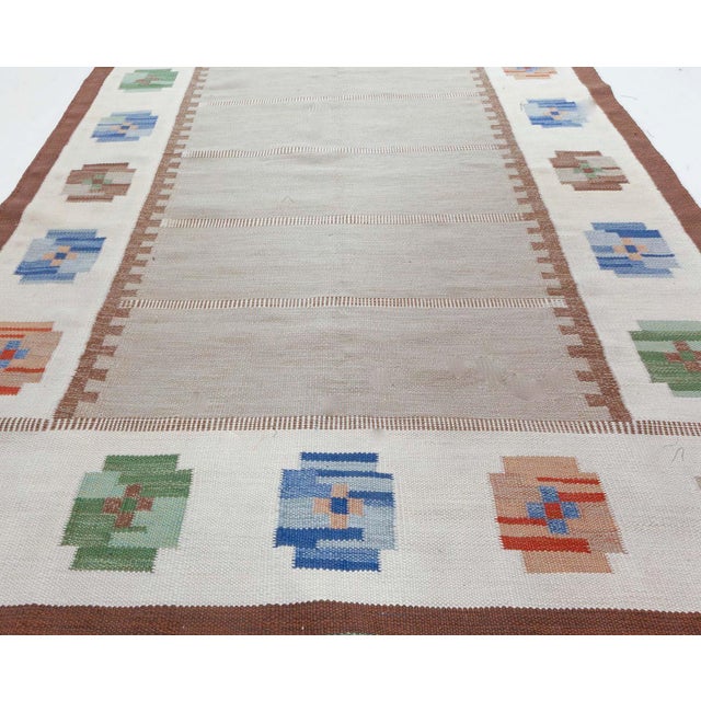 Mid-20th Century Swedish Flat Weave Rug. Size: 5'7" × 8'0" (170 × 243 cm). This charming mid-century Swedish flat-weave...