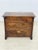 Vintage chest of drawers in colonial style, featuring classic English design. The decorative brass handles lend the piece...