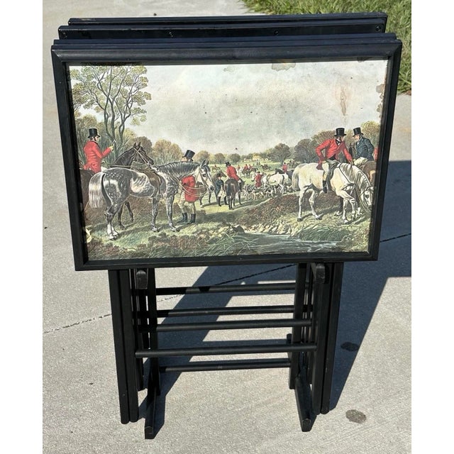 Vintage 1960s/1970s set of four folding TV snack trays with a storage stand. Black with a classic English fox hunting...