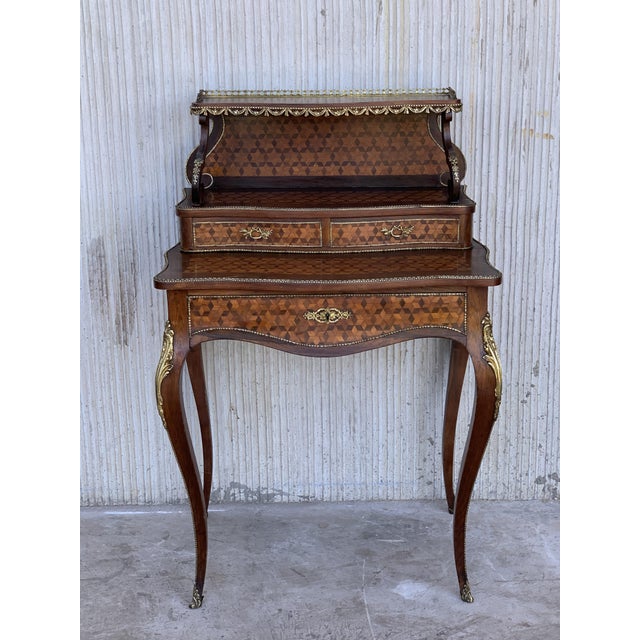 About Well proportioned boudoir writing desk with flip out, brown leather writing surface. The upper shelf is at 42.5...