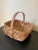A beautifully woven early 20th century American splint oak basket with warm honeyed tones and a tightly constructed...