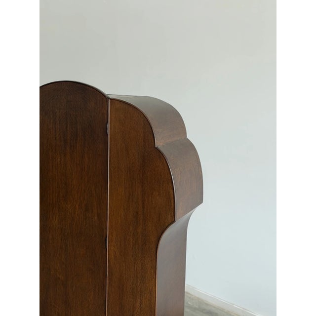 W45.25 D17 H73.5 Interior hanging space W15 This is a defining piece of art deco design. The dramatic, multi-tiered...
