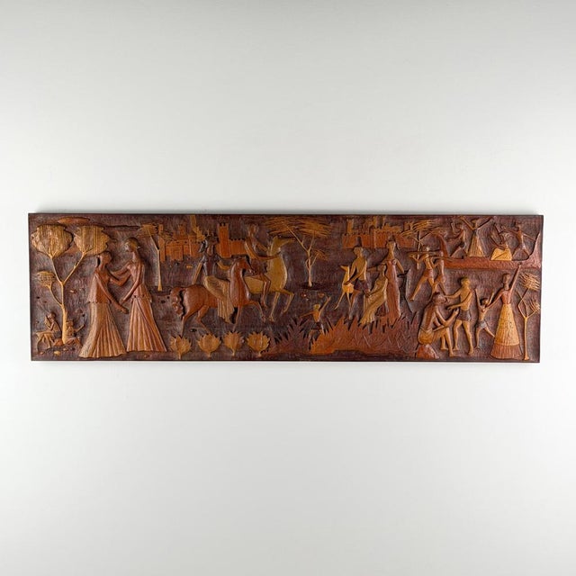 An extraordinary and highly evocative carved wall panel in solid walnut, Italy, circa 1950s, attributed to Giovanni...