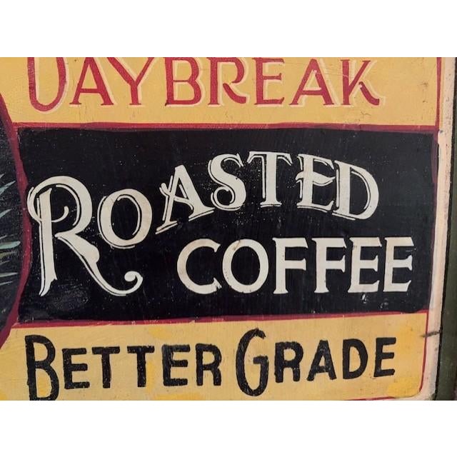 A hand-painted sign featuring 'Daybreak Roasted Coffee', by artist Patricia McKee Little. Made of wood with a resin frame,...