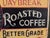 A hand-painted sign featuring 'Daybreak Roasted Coffee', by artist Patricia McKee Little. Made of wood with a resin frame,...