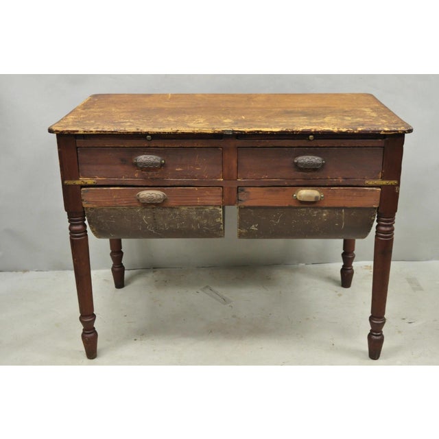 Antique French Country Primitive Possum Belly Pine Wood Bakers Work Table. Item features two galvanized flour bin drawers,...