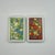 A set of two vintage playing card decks in an early plastic black case with makers monogram. The blue & green decks is...