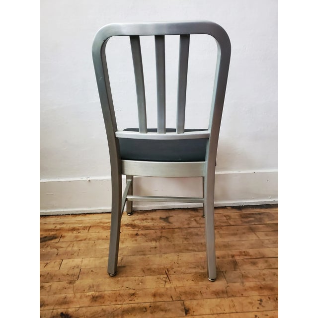 Mid Century era Goodform Navy Chair. Lightweight brushed aluminum frame with commercial weight vinyl upholstered seat...