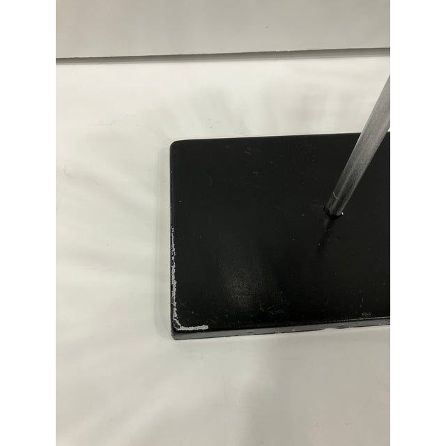 This hand crafted iron sculpture is in the style Of Curtis Jere Measures: 17 height 11 diameter Base is 5.5 x 8