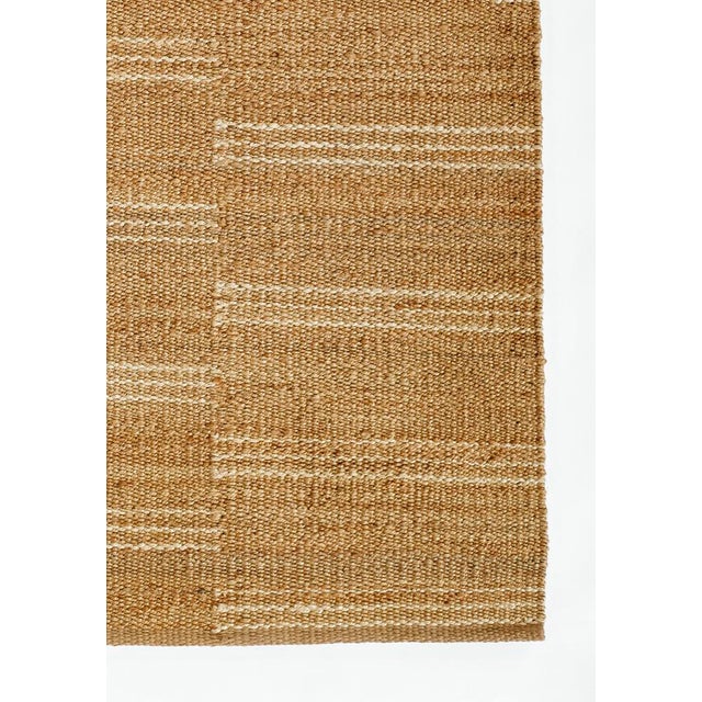 This handwoven white striped jute rug from the Crescent Collection is a natural beauty. A fresh take on a more traditional...