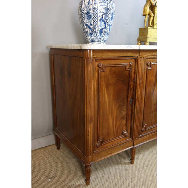 A louis xvi period mahogany sideboard stamped dester with the guild mark beneath the marble top. Godefroy dester...