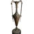 Description: Striking neoclassical urn featuring an elegant amphora form with high scrolled handles, fluted neck, and...