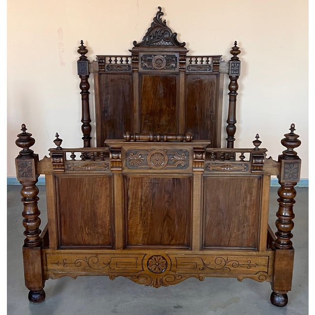 An Exquisite antique French Louis XVI full size bed. Made of Rosewood featuring foliate carved ribbon and crest with...