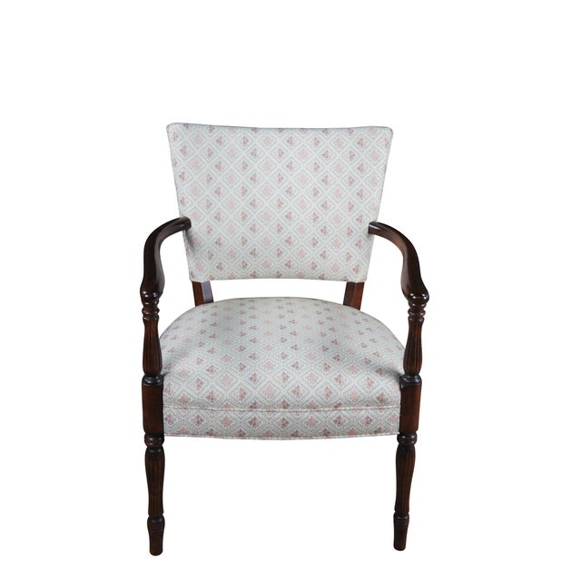 Mid 20th Century Martha Washington Style Arm Chair. Features a mahogany frame with a flared back and contoured arms over...