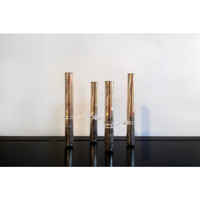 Candelabra with silver-plated metal frame and acrylic glass details. Manufacturer: Lino Sabattini 1970s This piece has an...