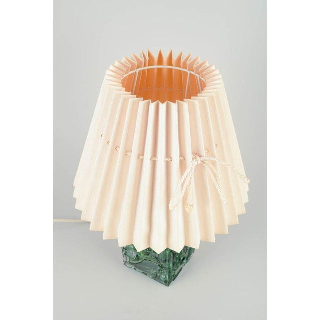 Josef Schott Czech art glass designer. Table lamp in molded glass, 1970s. Rectangular lamp base in heavy pressed green art...