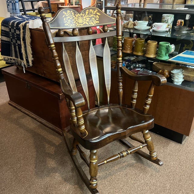 Virginia house brand solid wood rocking chair with original gold stenciling has slight wear from use please see the pictures.