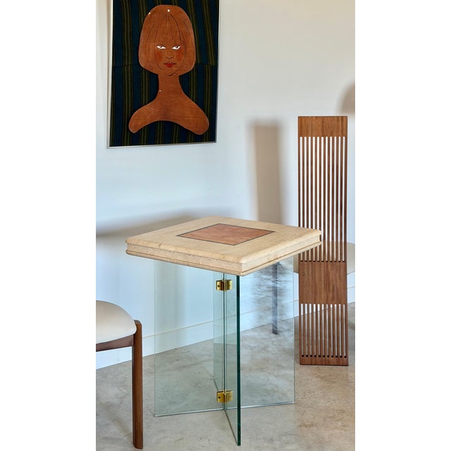 A solid travertine top in natural tan, with a red travertine square center bordered by a slate trim. We had the glass,...