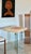 A solid travertine top in natural tan, with a red travertine square center bordered by a slate trim. We had the glass,...