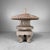 A Japanese garden lantern with a broad round roof, gracefully curved legs and a beautiful natural patina. Dimensions:...