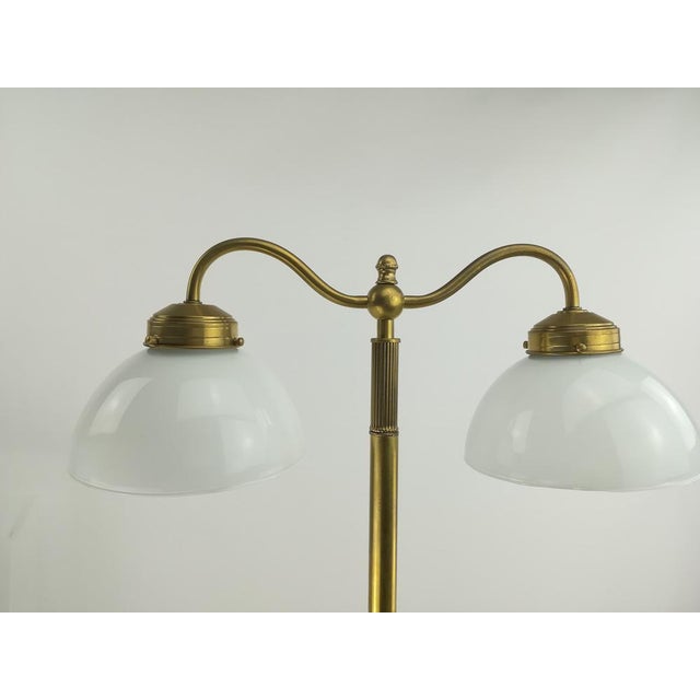 Rare lamp for reading corner or as a cozy light dispenser. Brass polished, two-layer glass. Version: Porcelain E27....