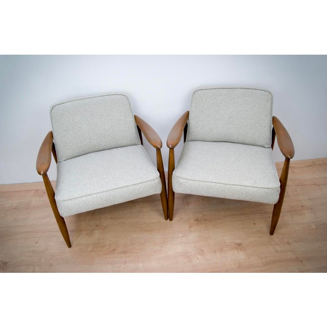 - This pair of GFM-87 chairs was manufactured by Gościńskie Furniture factory in the 1960s to 1970s - Designed by Juliusz...