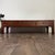 Lovely coffee table with a modern mid-century Asian style. Features a low profile, stunning grain patterning, and three...