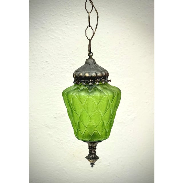 Vintage midcentury cast green glass lantern with cast bronze fittings- 24” of vintage chain and canopy included. Very good...