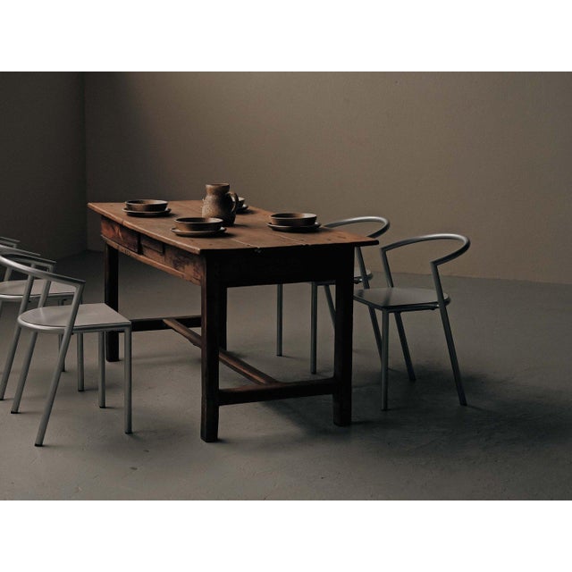 Traditional farmhouse table from the Auvergne region dates to around 1900 and is crafted entirely from solid wood. The...