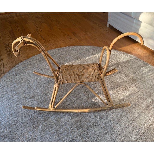 A sculptural tour de force of mid-century Italian design, this rattan and bamboo rocking horse is attributed to the...