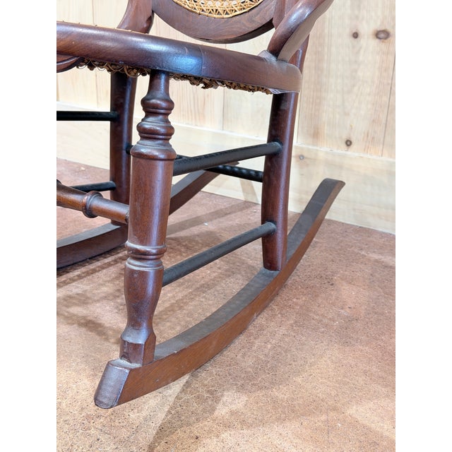 Wood Vintage Victorian Mahogany Cane Back Rocking Chair With Carved Crest For Sale - Image 7 of 7