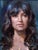 This oil painting features a close-up portrait of a woman with long, flowing hair and a serene expression. The artist...