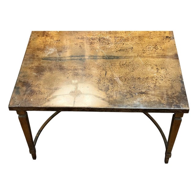 A striking 1950s coffee table finished in richly toned goatskin parchment, attributed to the workshop of Italian designer...
