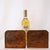 A pair of hammered copper bookends with an embossed design of Viking sailing ships on the waves. The bookends have an Arts...