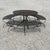 This terrific patio set is an uncommon one by Woodard. Comprised of a four foot table with three curved benches, it is...