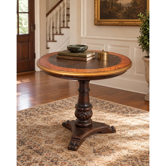 A wonderfully decorative round pedestal table featuring an Old World Italianate design with Renaissance Revival and...