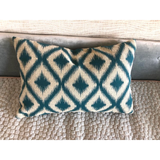 A small lumbar pillow cover with a bold pattern made with Kravet’s Caribbean Ikat. Zipper closure. Insert sold separately.